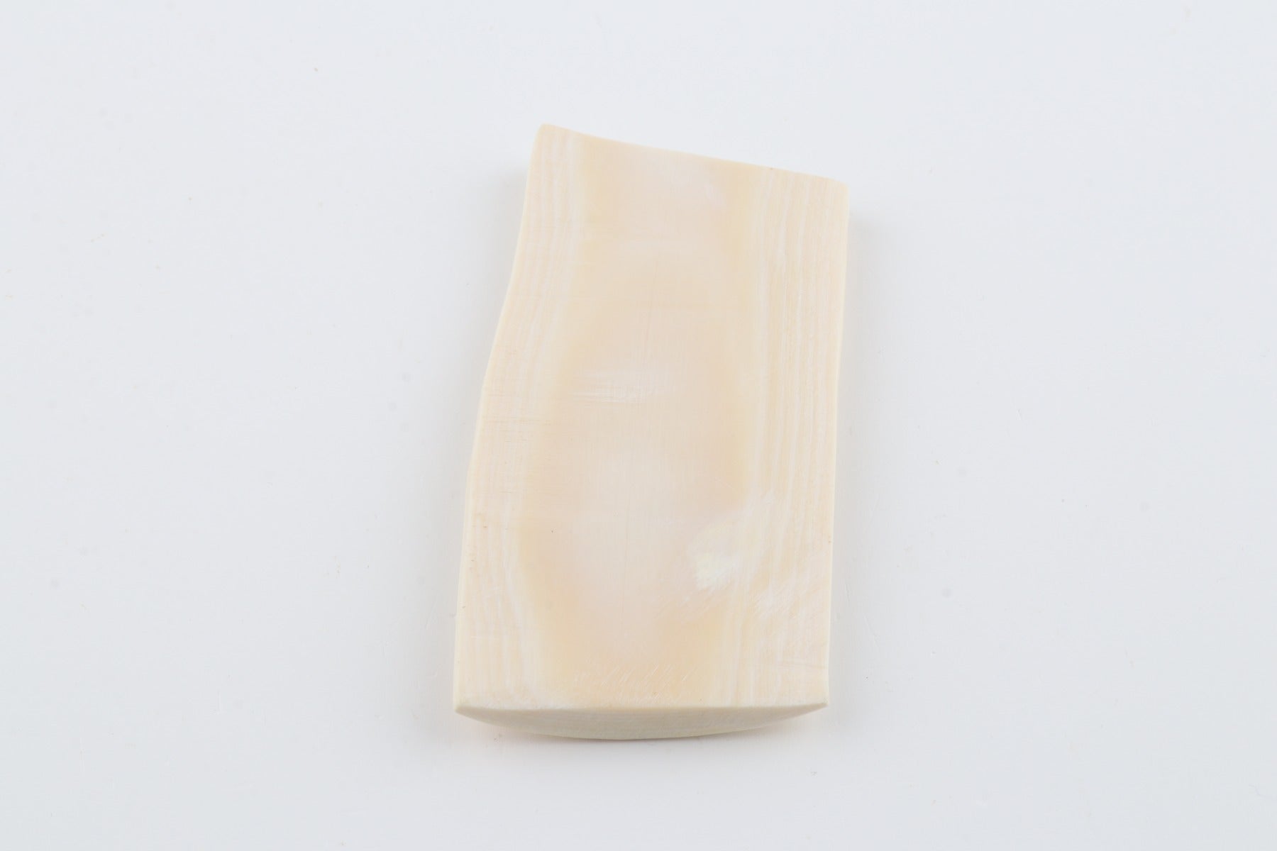 White mammoth ivory piece