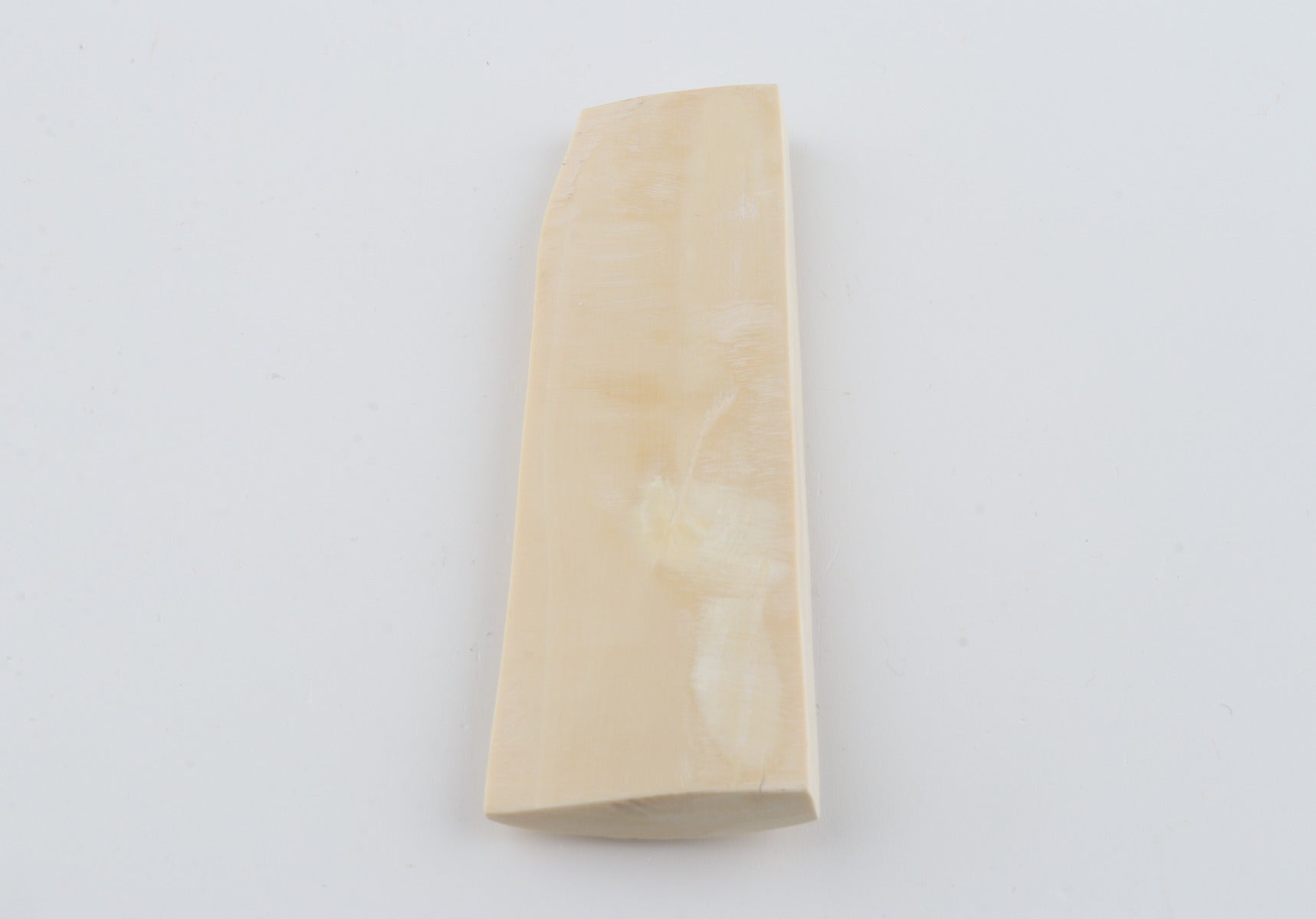 White mammoth ivory piece