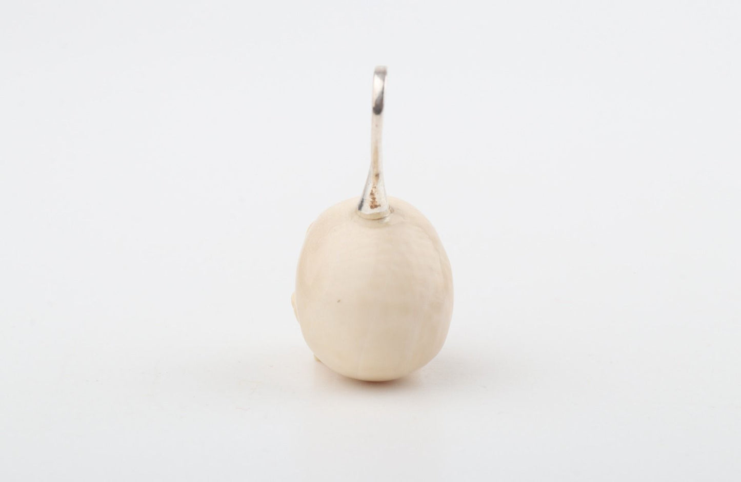 Festive Mammoth Ivory Skull Pendant