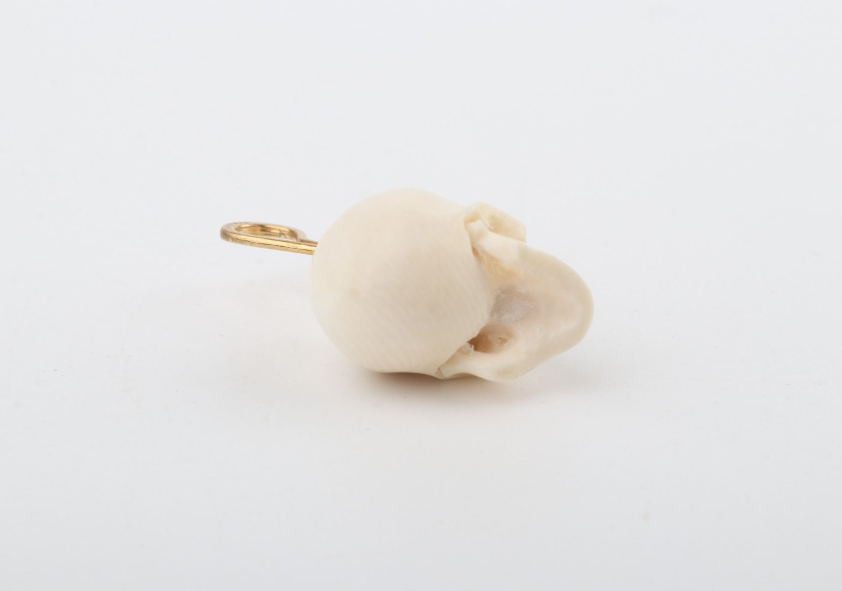 Festive Mammoth Ivory Skull Pendant