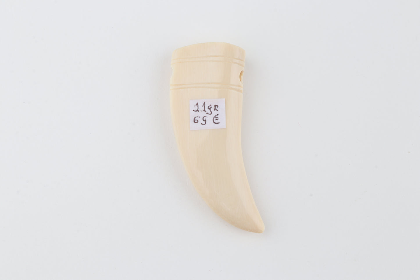 Carved mammoth ivory pendant