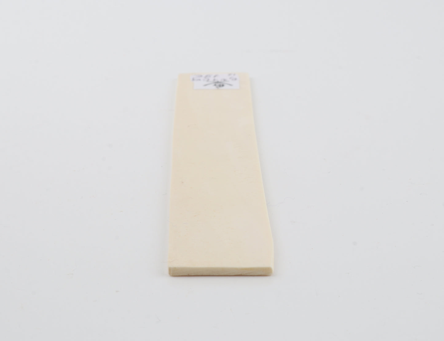 White mammoth ivory piece