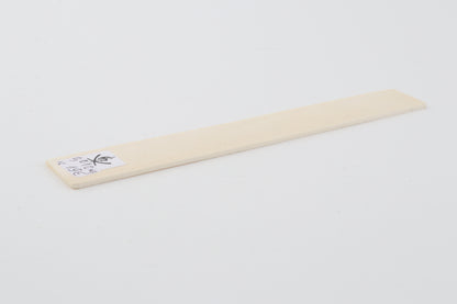 White mammoth ivory piece