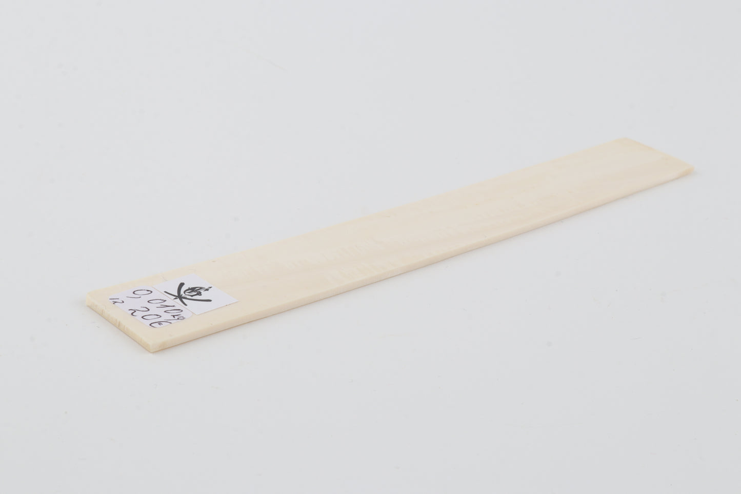 White mammoth ivory piece