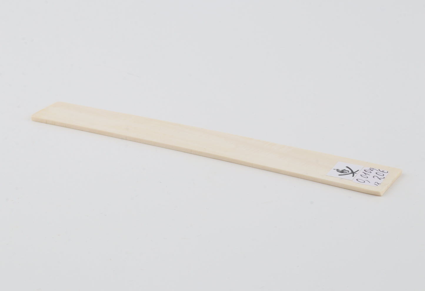 White mammoth ivory piece