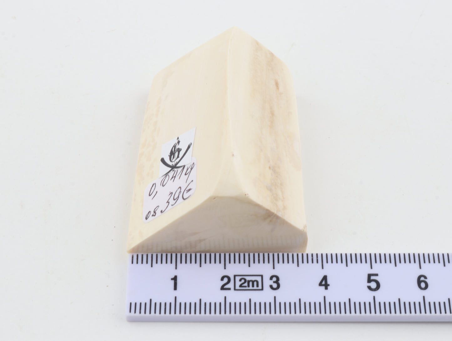 White mammoth ivory piece