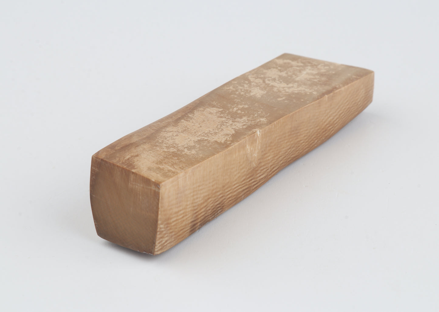 Brown mammoth ivory piece