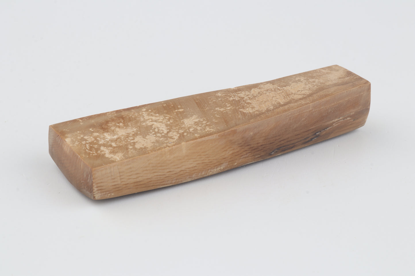 Brown mammoth ivory piece