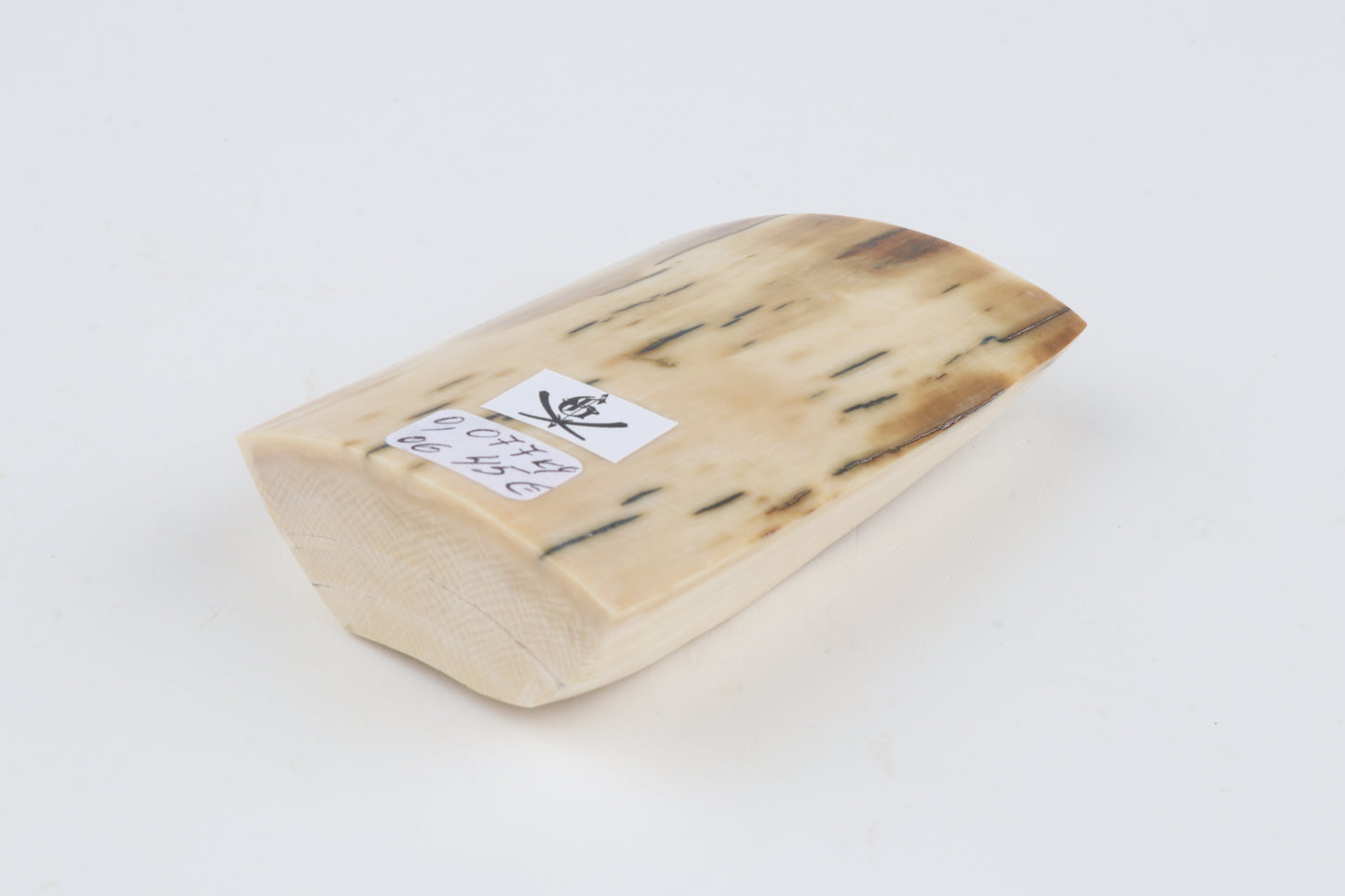 White-beige mammoth ivory piece
