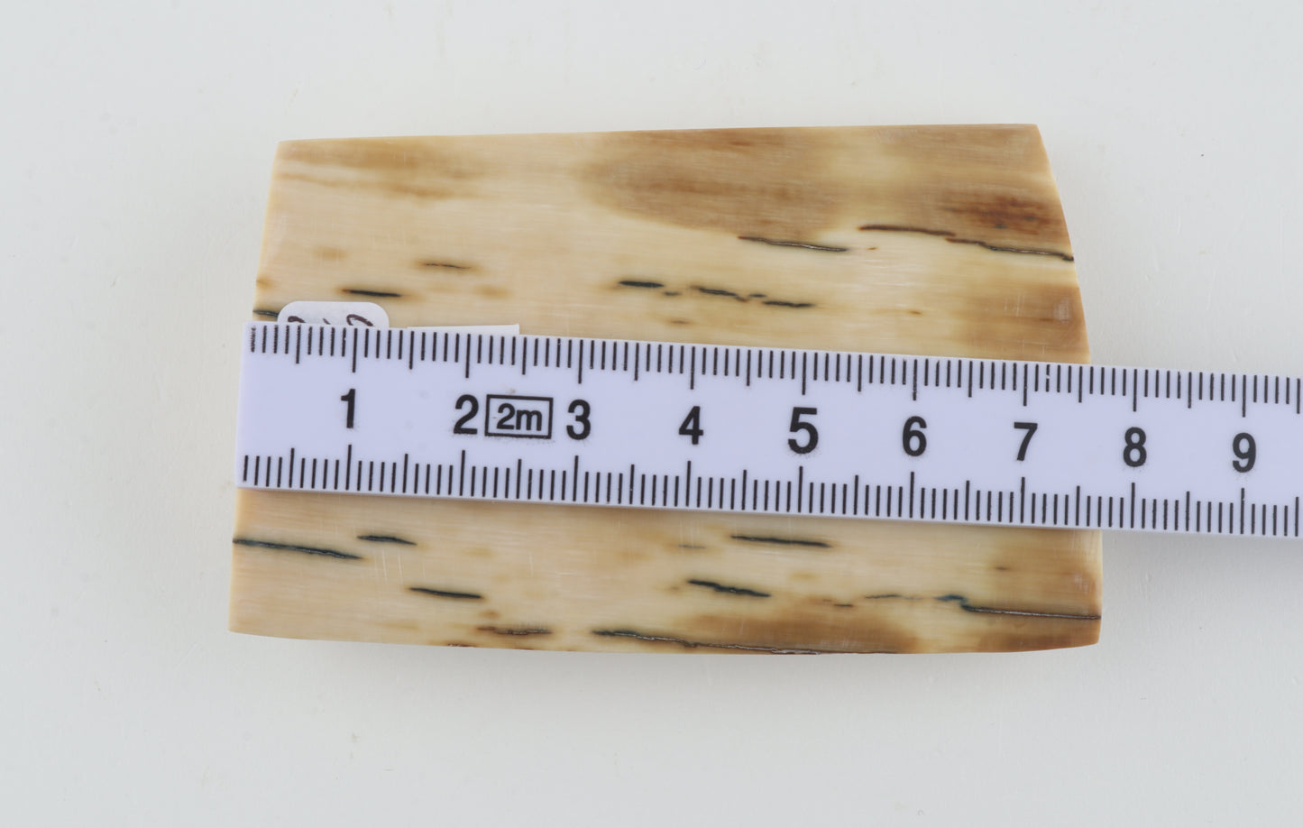 White-beige mammoth ivory piece