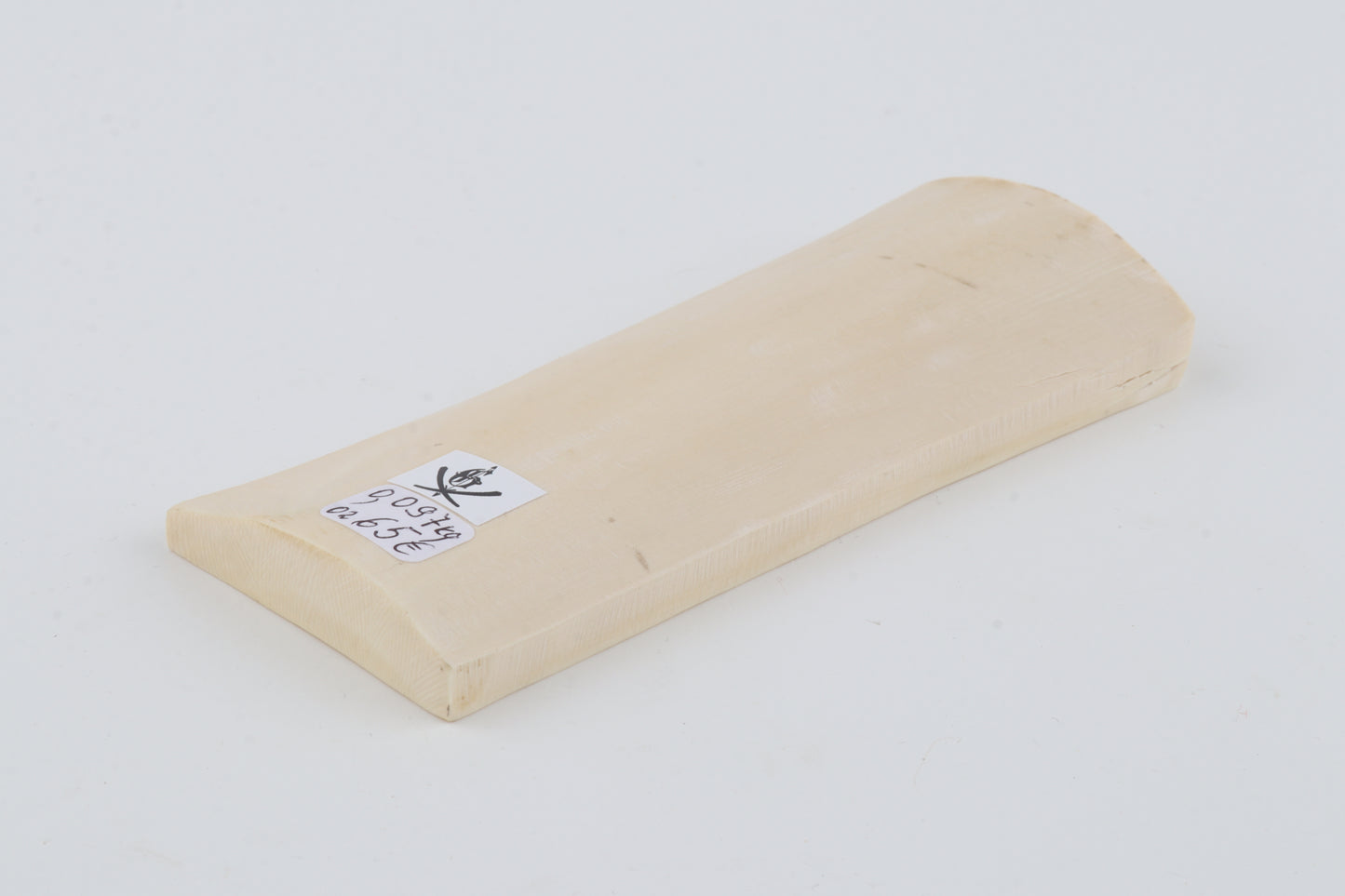 White mammoth ivory piece