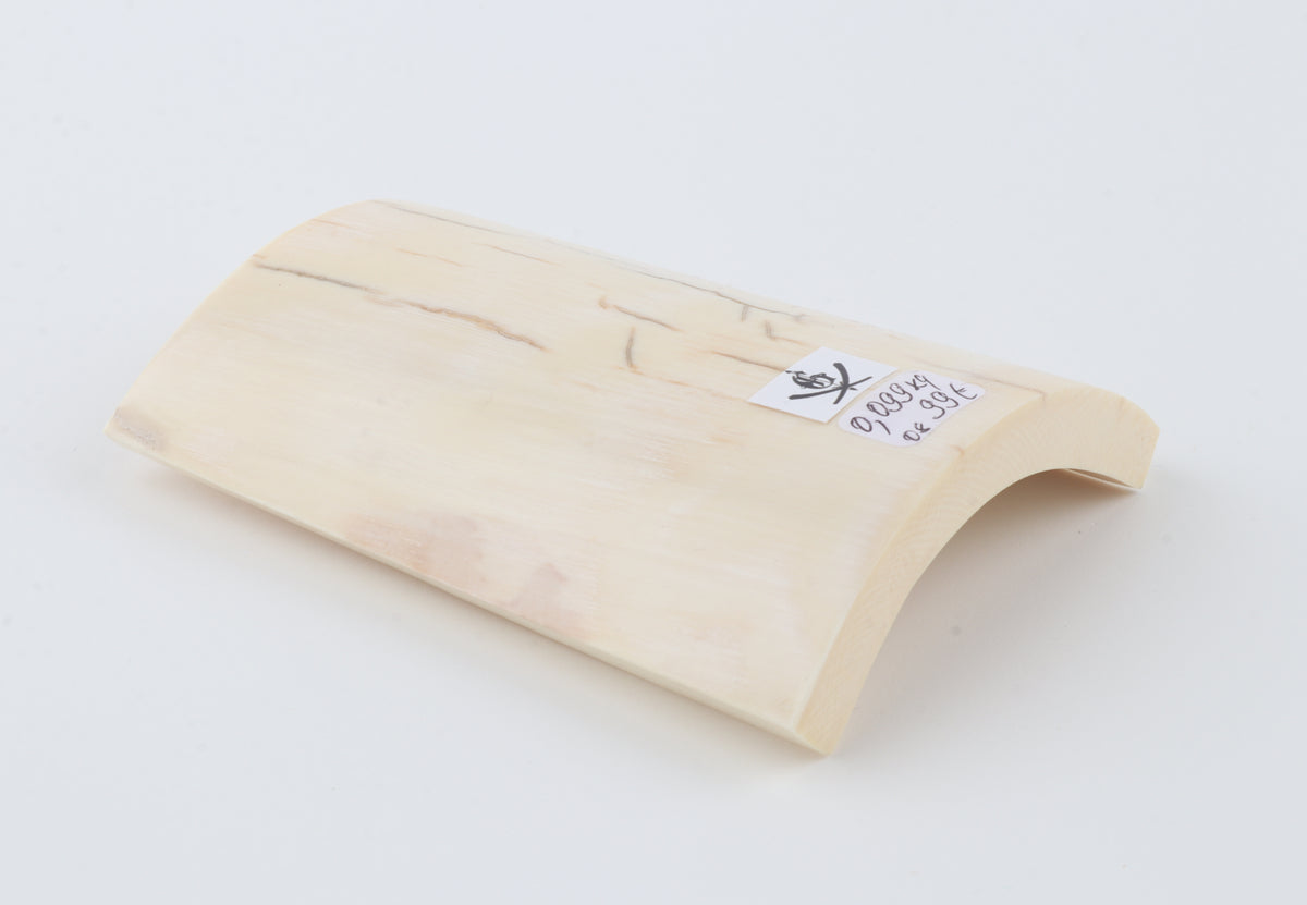 White mammoth ivory piece