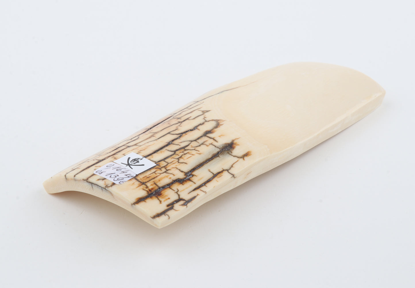 White mammoth ivory piece
