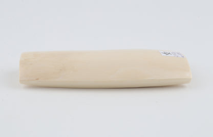 White mammoth ivory piece