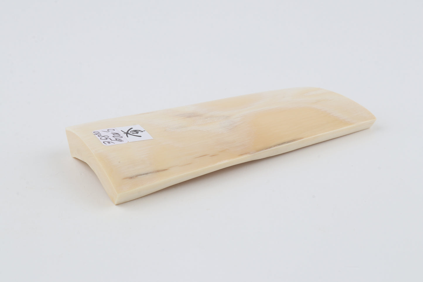 White mammoth ivory piece