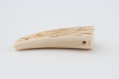 Carved mammoth ivory pendant