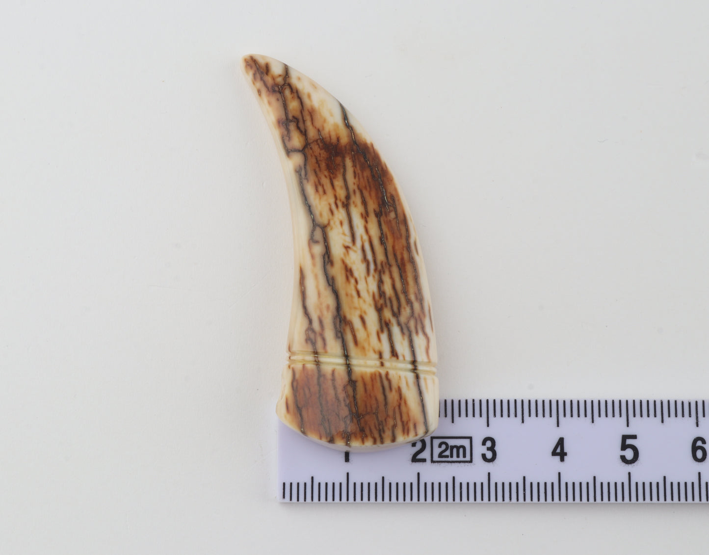 Carved mammoth ivory pendant