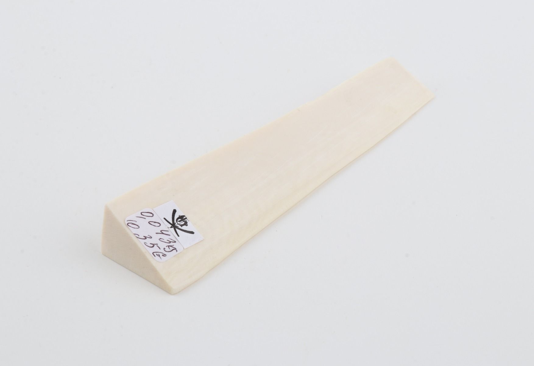 White mammoth ivory piece