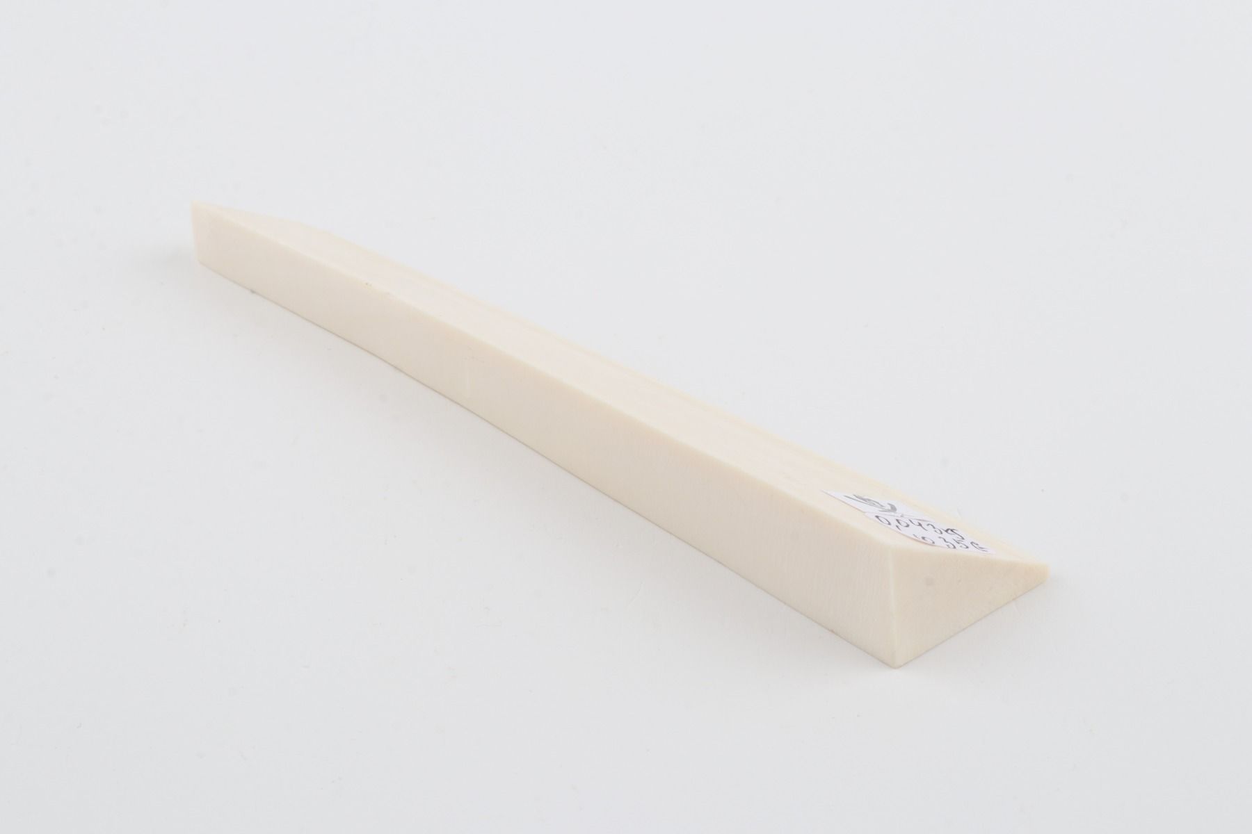 White mammoth ivory piece