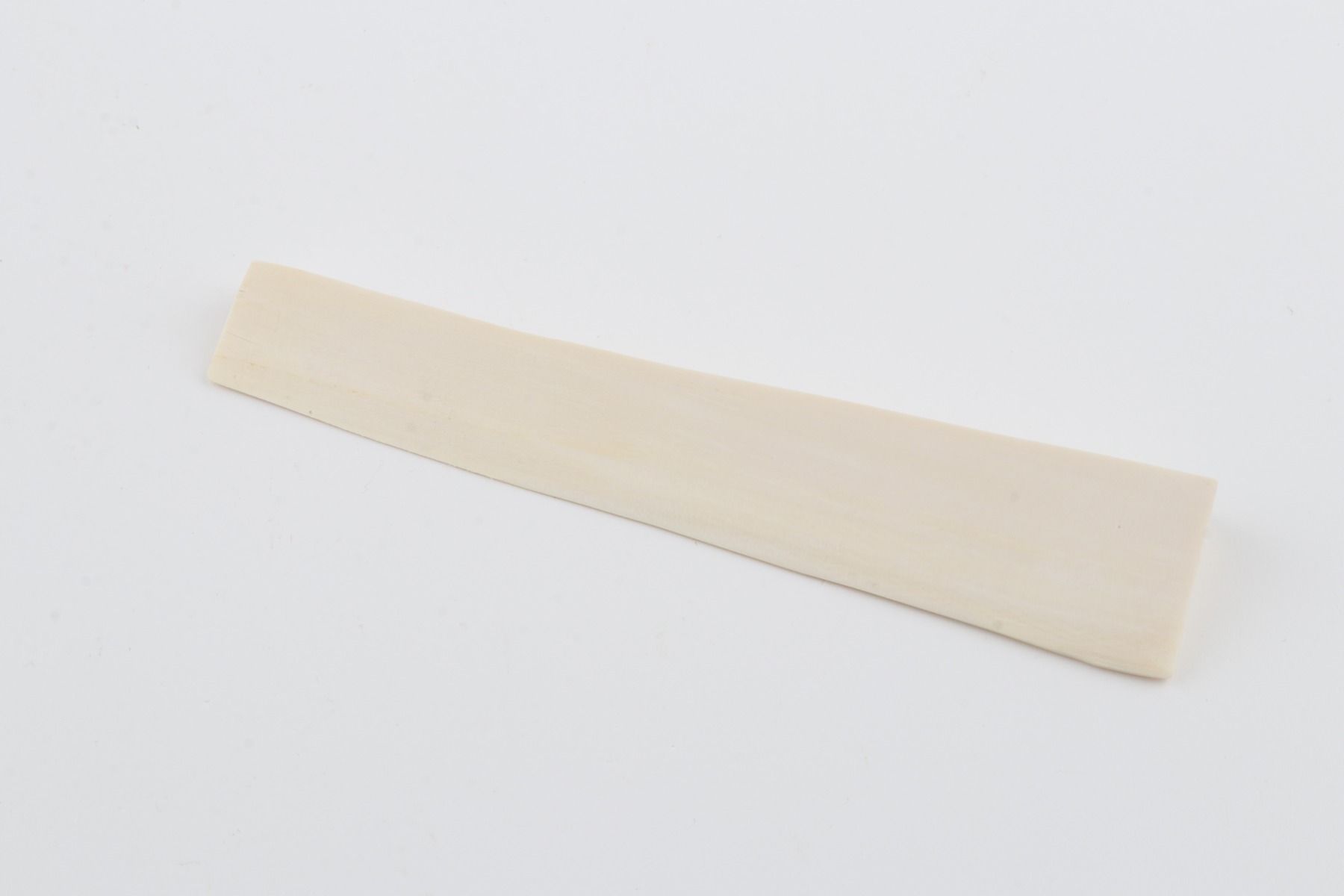 White mammoth ivory piece