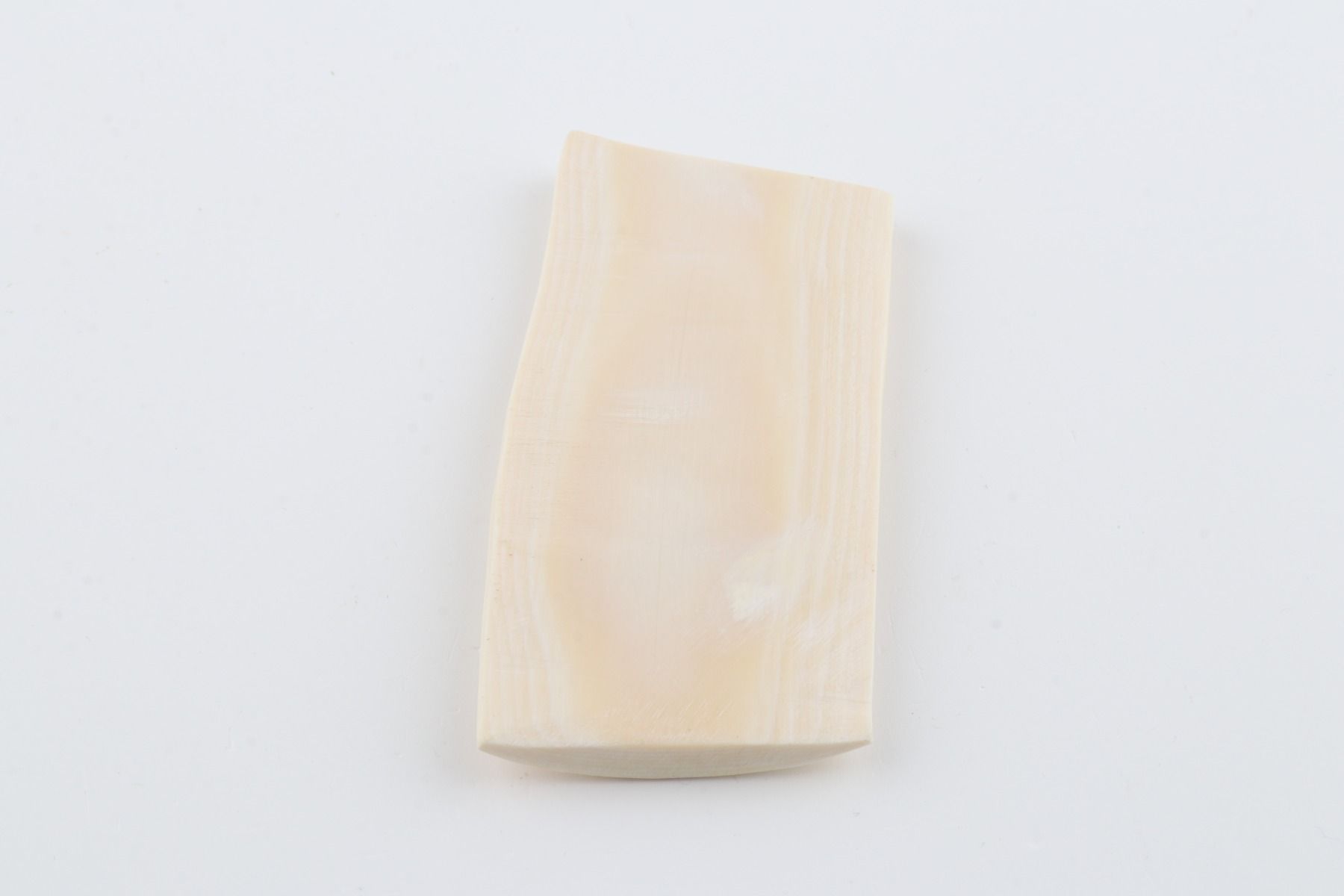 White mammoth ivory piece