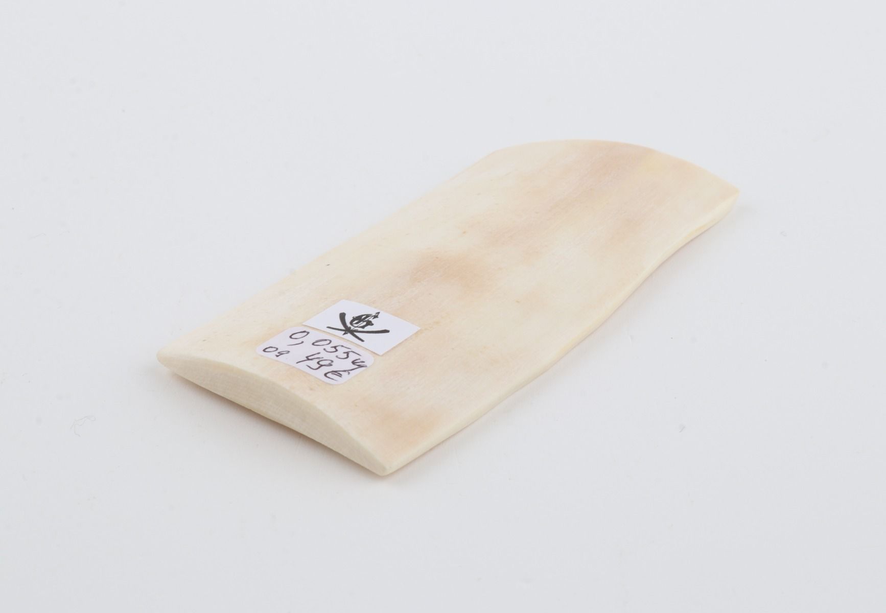 White mammoth ivory piece