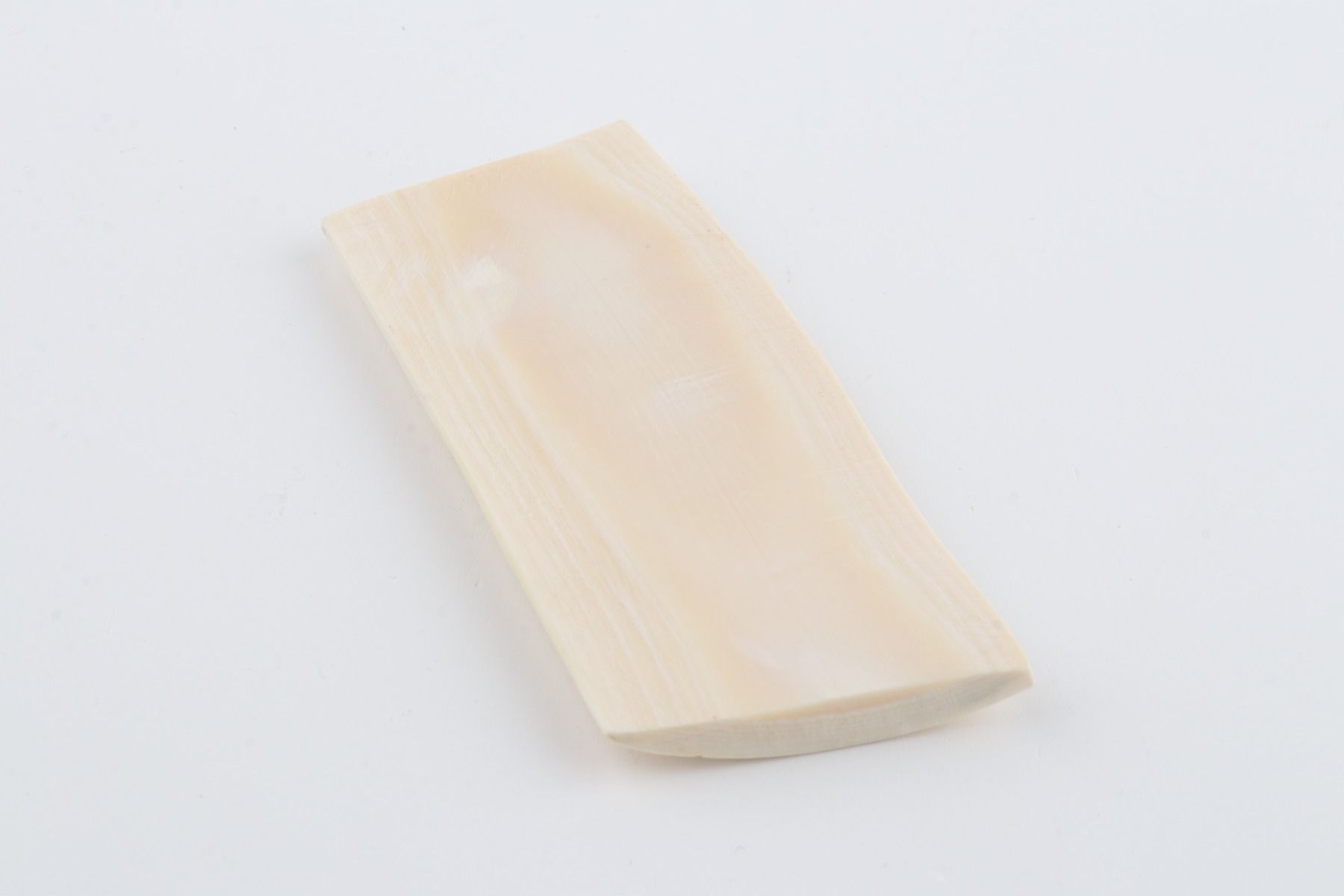 White mammoth ivory piece
