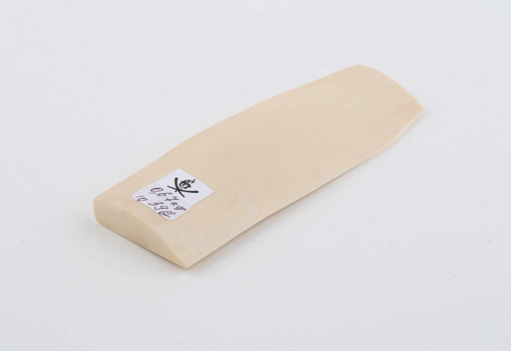 White mammoth ivory piece