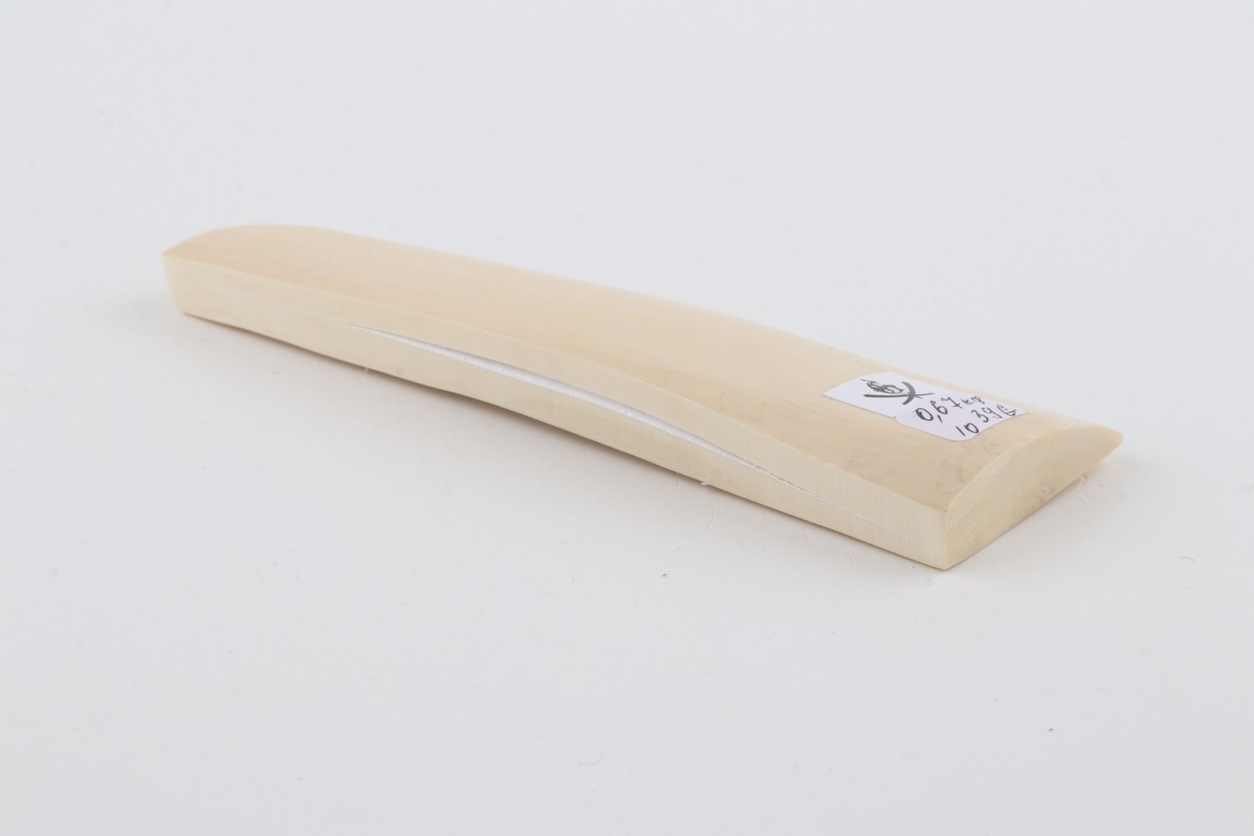 White mammoth ivory piece