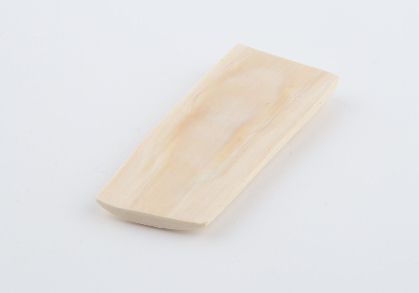 White mammoth ivory piece