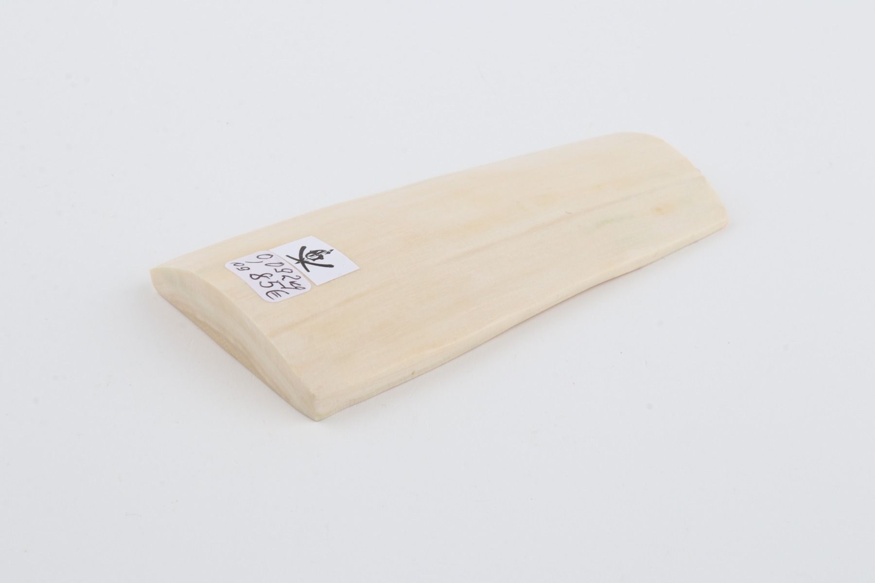 White mammoth ivory piece