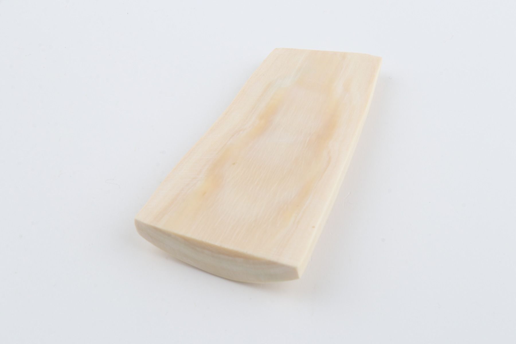 White mammoth ivory piece