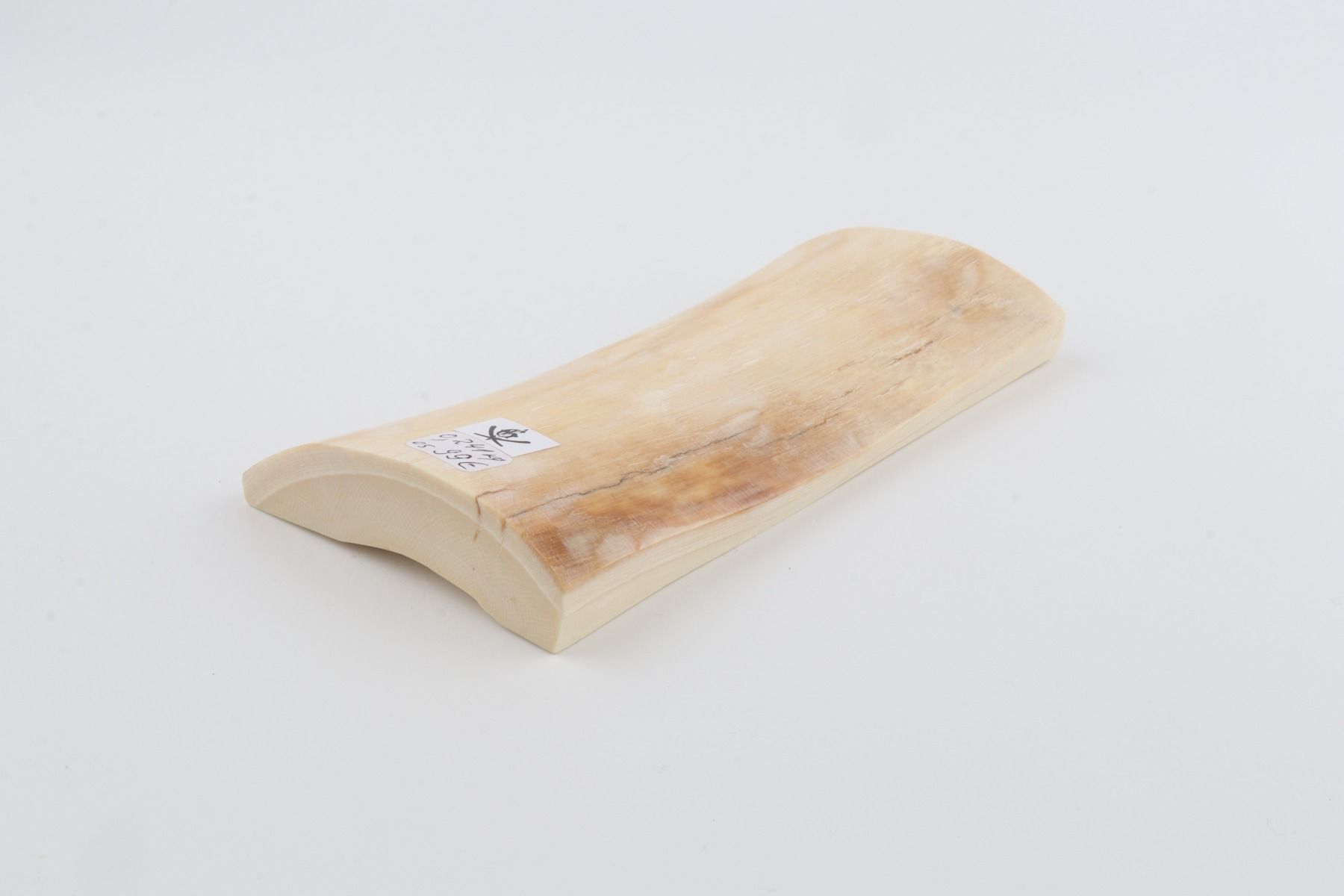 White mammoth ivory piece