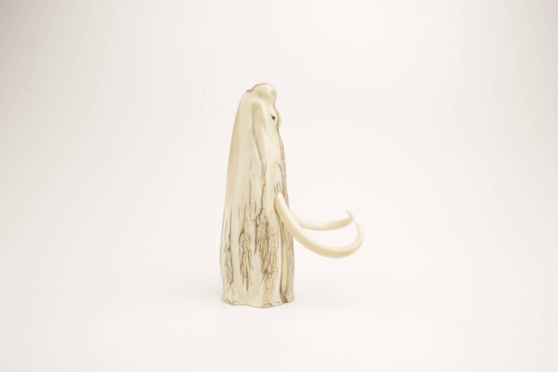 Carved woolly mammoth figurine - Arctic Antiques
