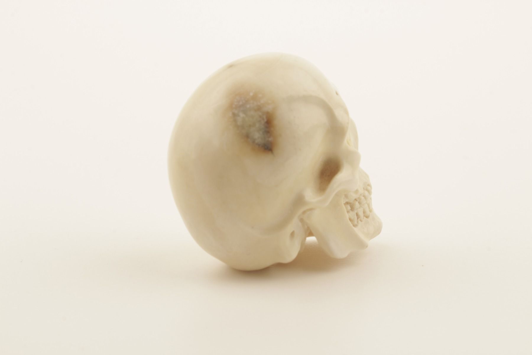 Hand-carved mammoth ivory skull