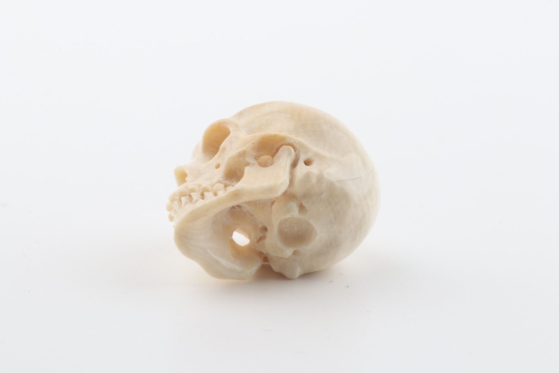 Carved woolly mammoth ivory skull 