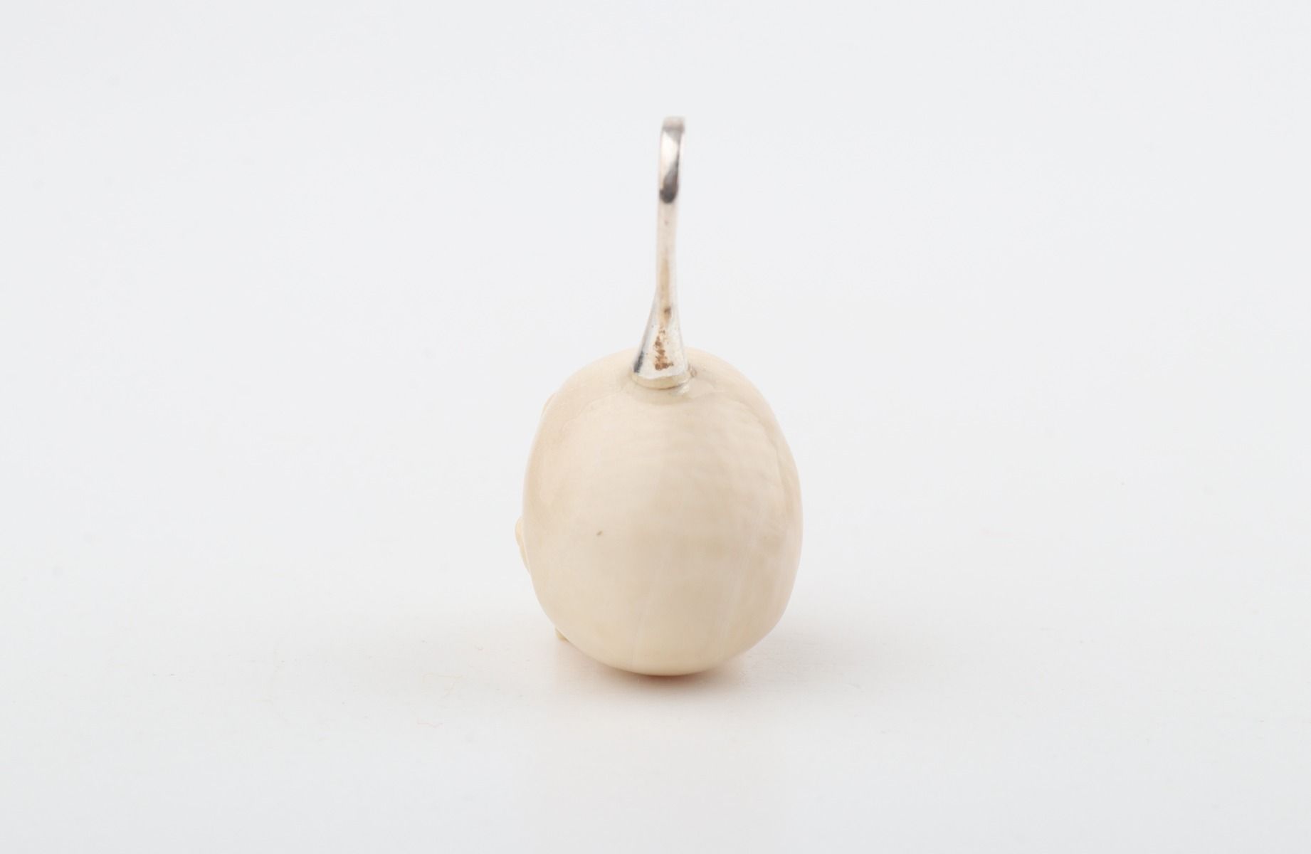 Festive Mammoth Ivory Skull Pendant 